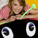 illustration of Giant Plush Bean Bag characters, shown here with Miley Cyrus, better known as Hannah Montana in Tiger Beat magazine.